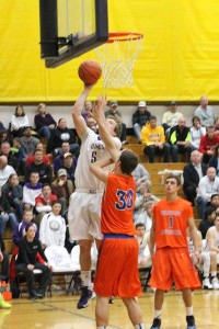 Senior DJ Winter goes up for a shot in the game against Graham- Kapowasin Jan. 24.