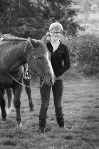 Sophomore Rebecca Martin stands with her chestnut Quarter Horse named Snickers. 