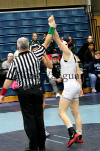 Junior Haley Franich gets her hand raised after she wins her championship match at the 112 weight class.