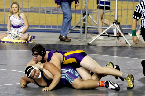 Senior Trent Nivala takes down his opponent in his second round match of the Washington State Wrestling Tournament Feb. 21 at the Tacoma Dome. 