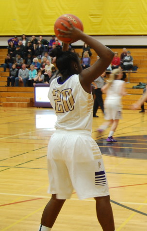 Sophomore Alexius Foster passes the ball to a teammate.