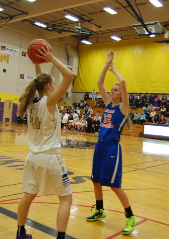 Junior Kylie Myers throws the ball back in bounds.