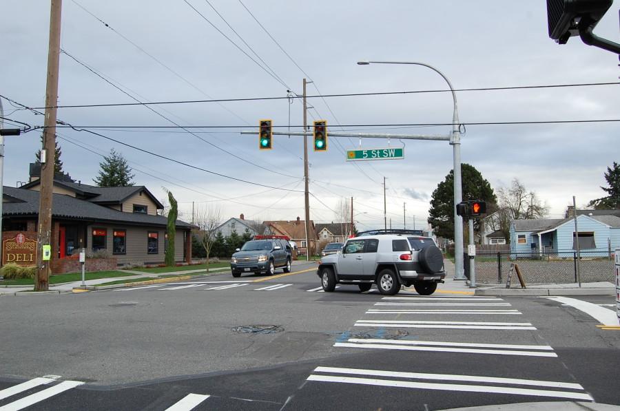 The new spotlight at the intersection of Fifth Street and Seventh Avenue was placed to reduce traffic and promote pedestrian and driver safety.