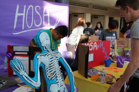HOSA promotes their upcoming events of a blood drive and a 5K run to help cure cancer. The Health Occupation Students of America club held their annual spring health fair March 26.