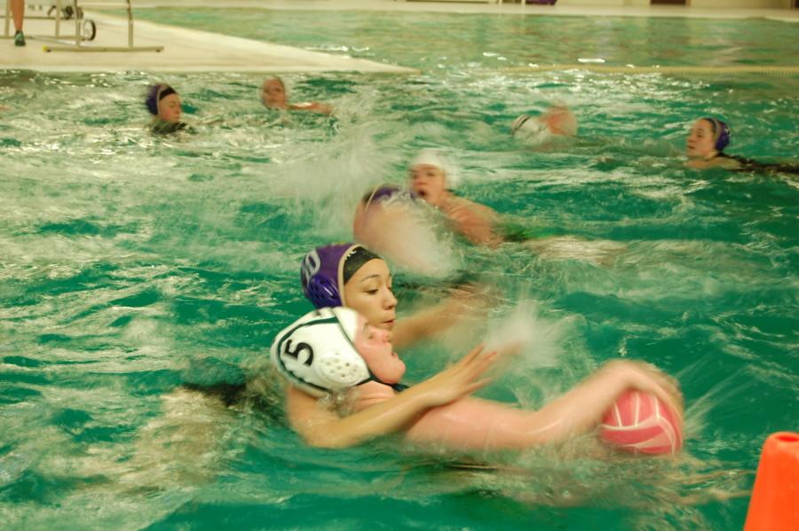 Ami Kiuchi guards an Emerald Ridge girl as she attempts to pass the ball to a teammate. The PHS girls Water Polo team went up against Emerald Ridge April 22. Puyallup won with a final score of 9-0. 