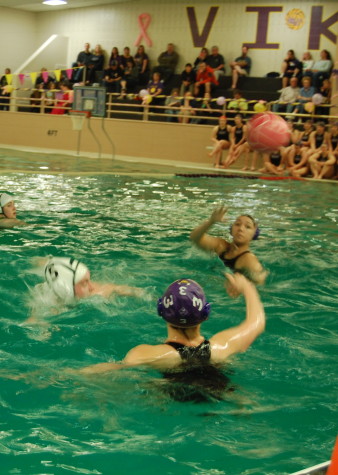 Junior Maddie Joy prepares to catch the ball from a fellow Viking. PHS girls Water Polo team went up against Emerald Ridge April 22. Puyallup won with a final score of 9-0. 