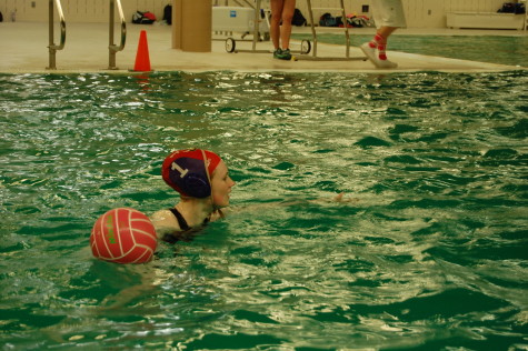Junior Mackenzie Davidson prepares to throw the ball down to her team. PHS girls Water Polo team went up against Emerald Ridge April 22. Puyallup won with a final score of 9-0. 