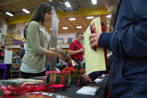 The Central Washington University representative talks to students about the programs CWU offers to students.  PHS held its annual Future Fair April 9 during third period. The fair presented students with a variety of colleges, universities, military representatives, employment opportunities and service organizations. 