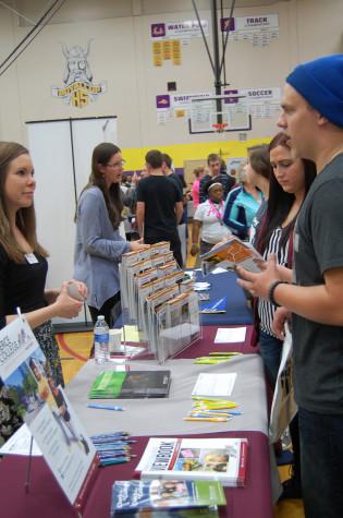 Students talk to the Pierce College representative. PHS held its annual Future Fair April 9 during third period. The fair presented students with a variety of colleges, universities, military representatives, employment opportunities and service organizations. 