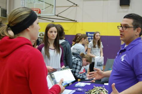 The University of Washington representative explains scholarship options. PHS held its annual Future Fair April 9 during third period. The fair presented students with a variety of colleges, universities, military representatives, employment opportunities and service organizations. 