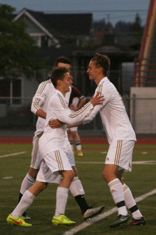 Teammates congratulate each other after the Vikings score a goal in the first half. The boys soccer team won against Bethel High School with a score of 7-0 April 21.