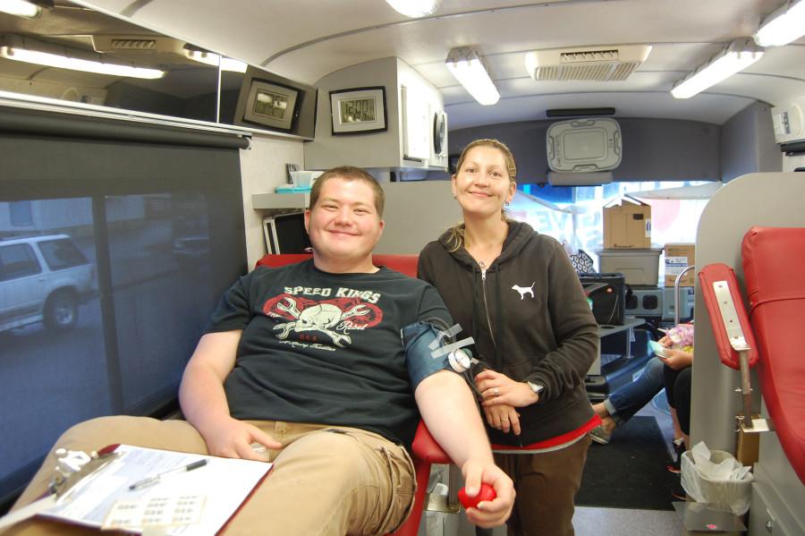 Sophomore Dawson Thompson smiles as he gives blood in the bus. HOSA held their last blood drive of the 2015 school year on June 1. 