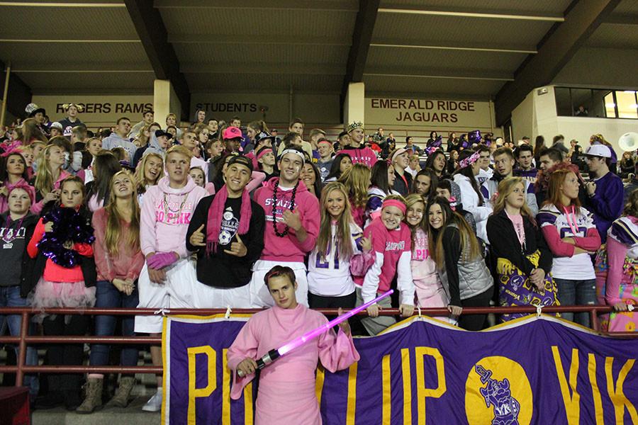 The student section poses for the camera before the game against Timberline on 10/23/15. The game was a pink out game to raise awareness for breast cancer 