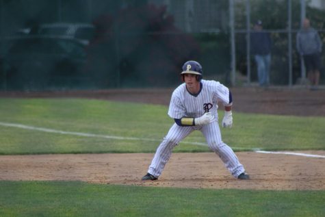 Leadoff hitter and centerfielder Riley Pletcher gets his lead off first in PHS' win against the Kentwood Chargers. 