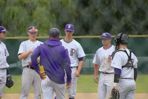Coach Marc Wiese goes out to meet the infield during PHS' 6-2 victory against Kentwood High School. 