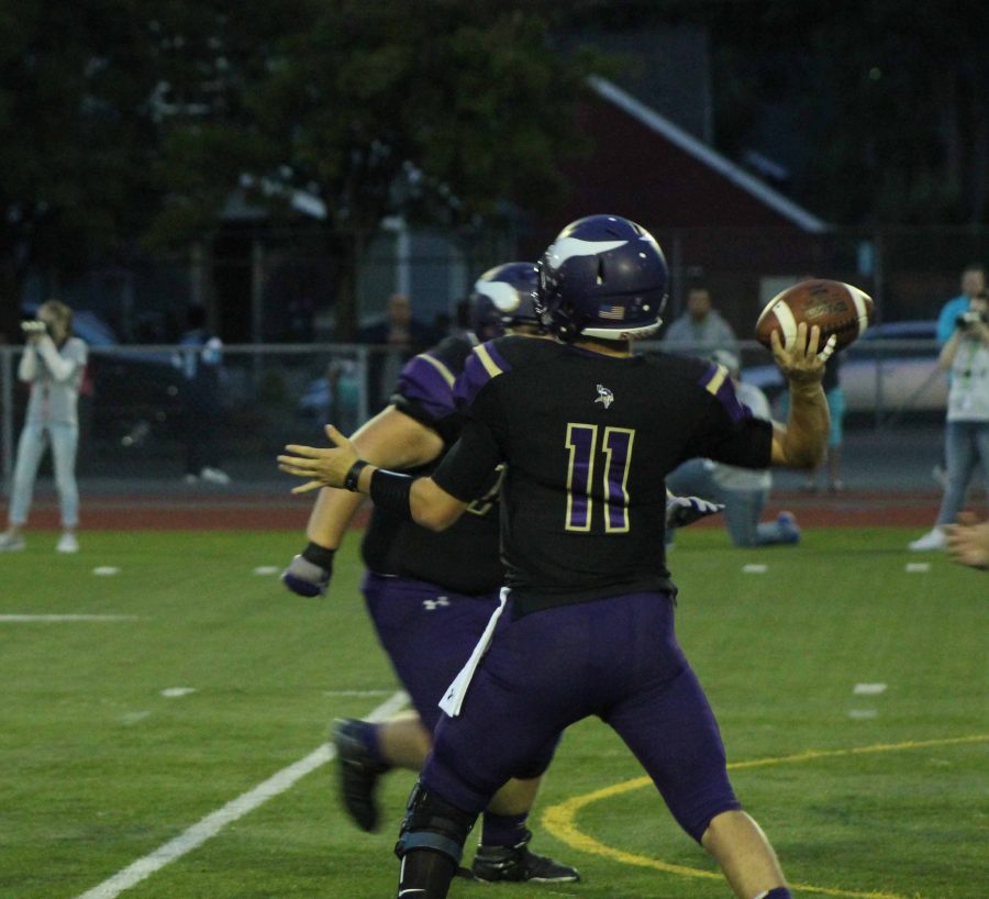 Holcomb throwing during PHS 49-7 victory over rivals the Rogers Rams. 