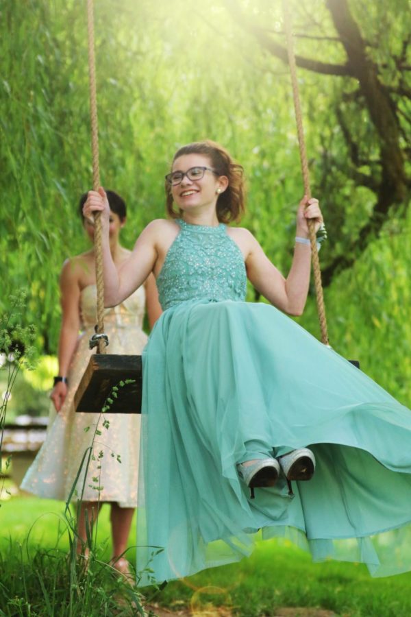 Seniors Arabella Taylor and friend enjoy the swing at one of the photo opportunities at prom. Senior Prom was held May 20 at Wild Hearts Farm in Puyallup. It wasnt your typical prom, Taylor said. But it was still so much fun. 