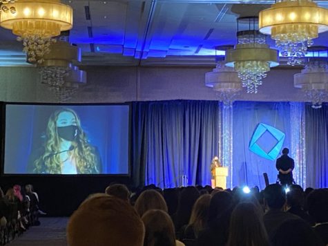 Senior Danielle Poulin speaks as Area 7 President and VP of Career Development for Washington DECA at the Fall Leadership conference in Bellevue, WA Nov. 7-9.