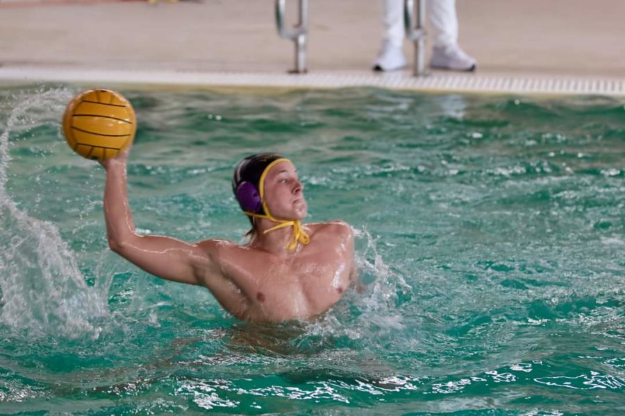 PHS+water+polo+captain+Luke+Taylor+throws+the+ball+for+his+team.+Water+polo+is+really+fun+and+I+really+love+everyone+on+my+team%2C+Taylor+said.