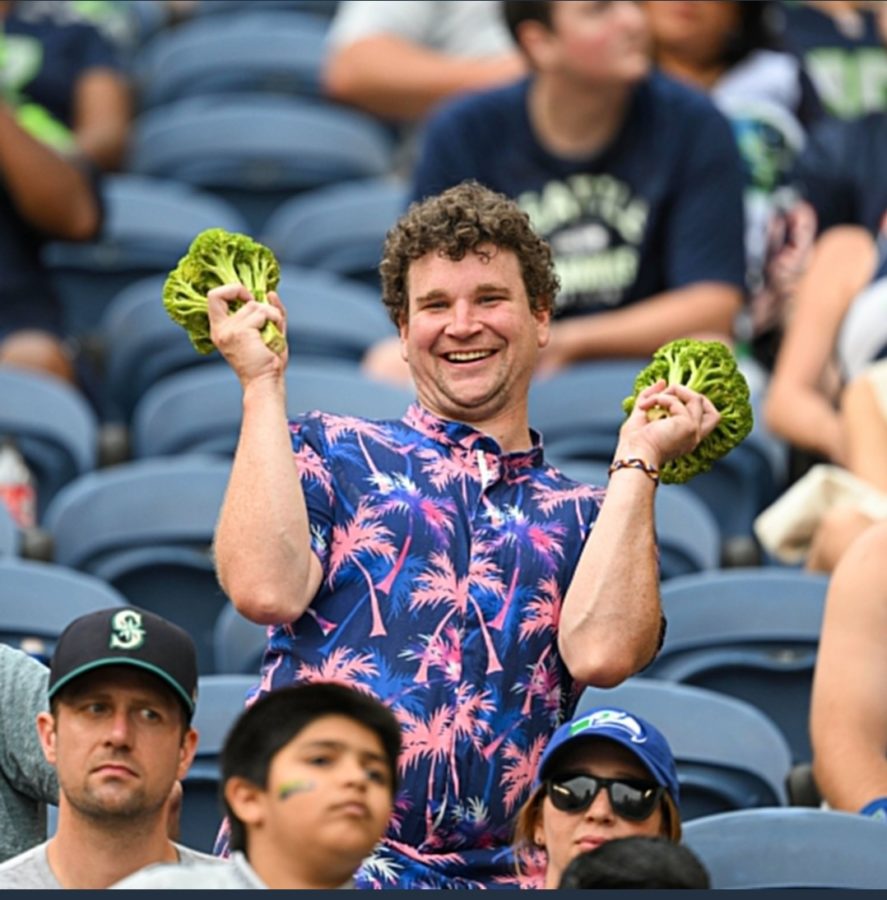 Jim Stewart Allen shows off his green, all natural pom-poms at a Seattle Mariners game. Photo curtesy of Jim Stewart Allen.
