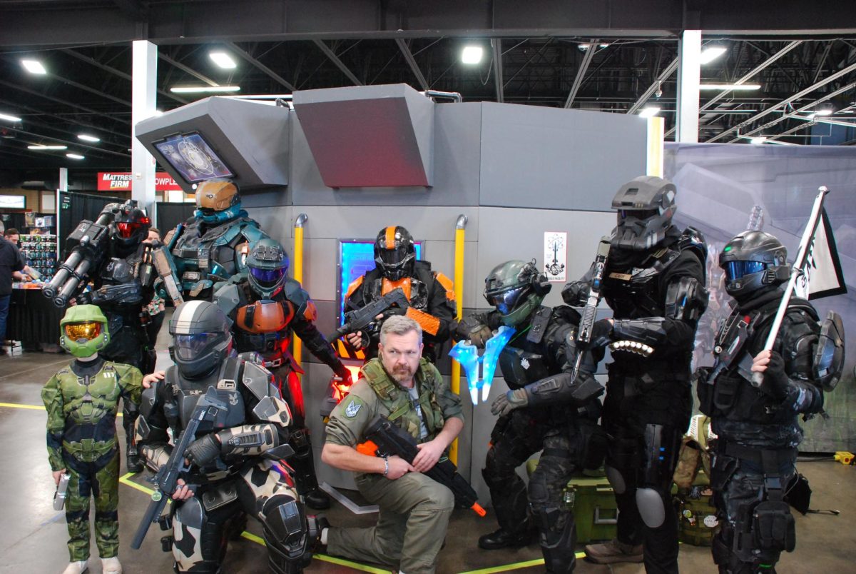 Members of the Pacific Regiment of the 405th pose in front of a backdrop at Washington State Gaming Expo.