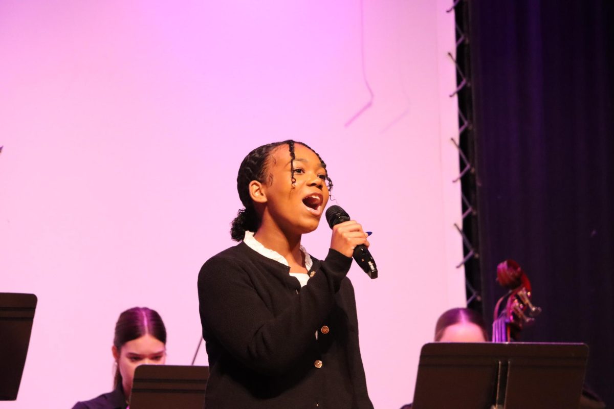 Jaylea Mills accompanies the Chamber Orchestra to the song "Left Every Voice and Sing" during the MLK Assembly.