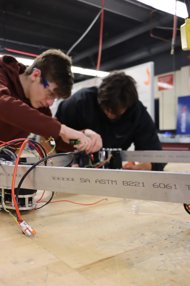 Colin Nelson works on this year's robot during an after-school meeting of Robotics Club