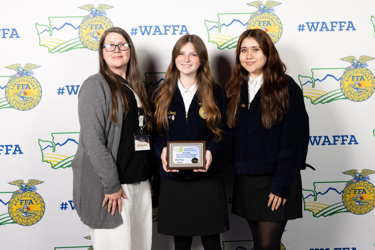 Suzanne Smith, Kenna Young and Vanessa Hernandez pose with their award at the WAFFA State Convention this past weekend.